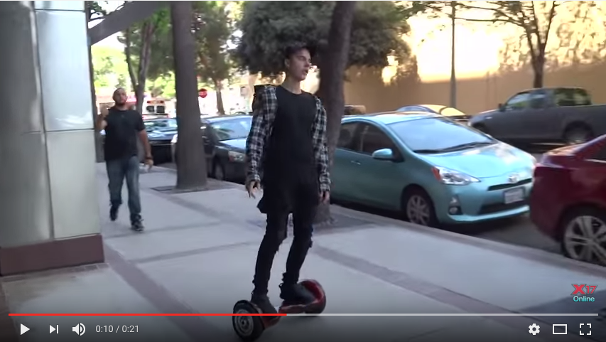 Justin Bieber riding a hoverboard